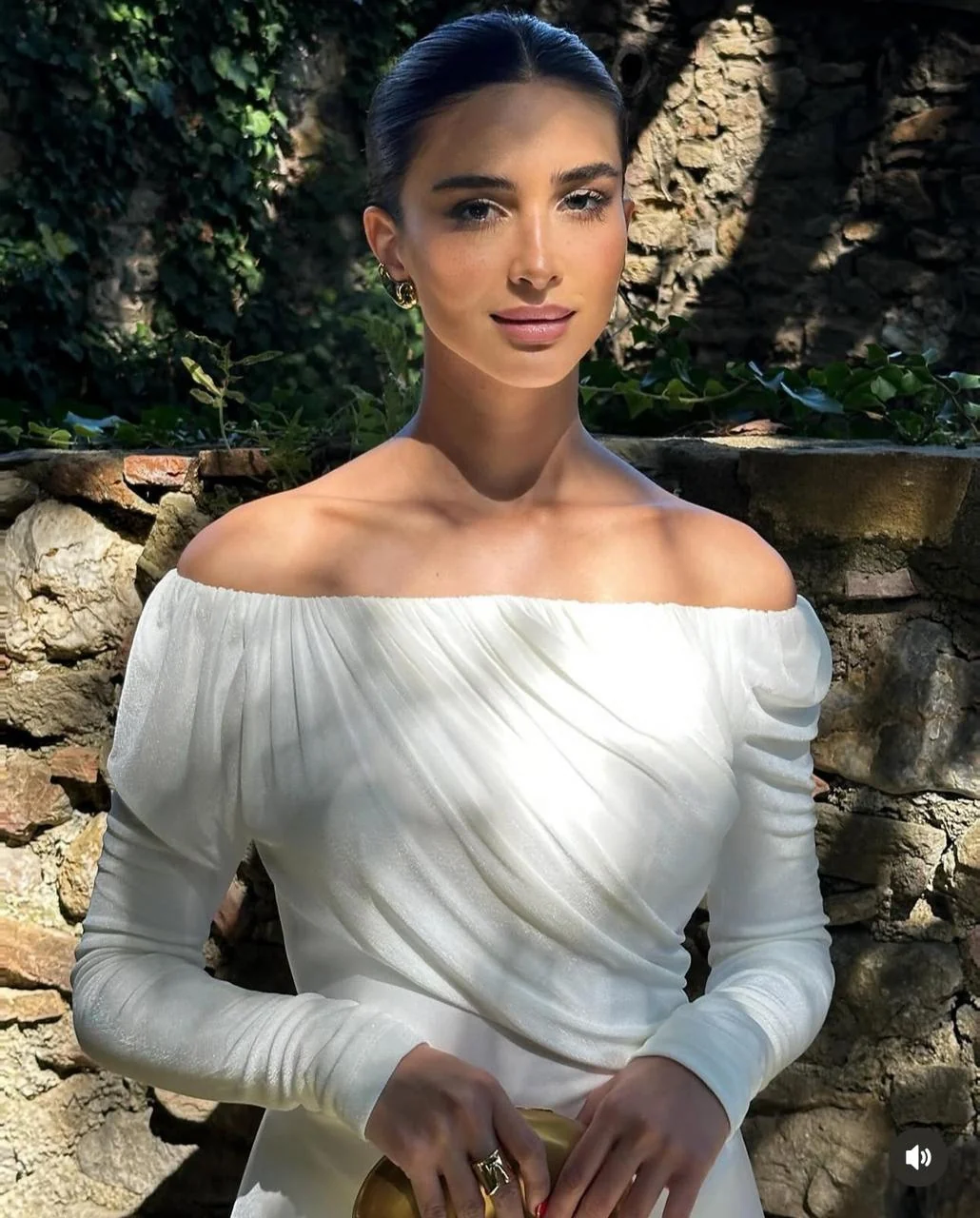 Rahaf Alharbi outdoors in a white dress